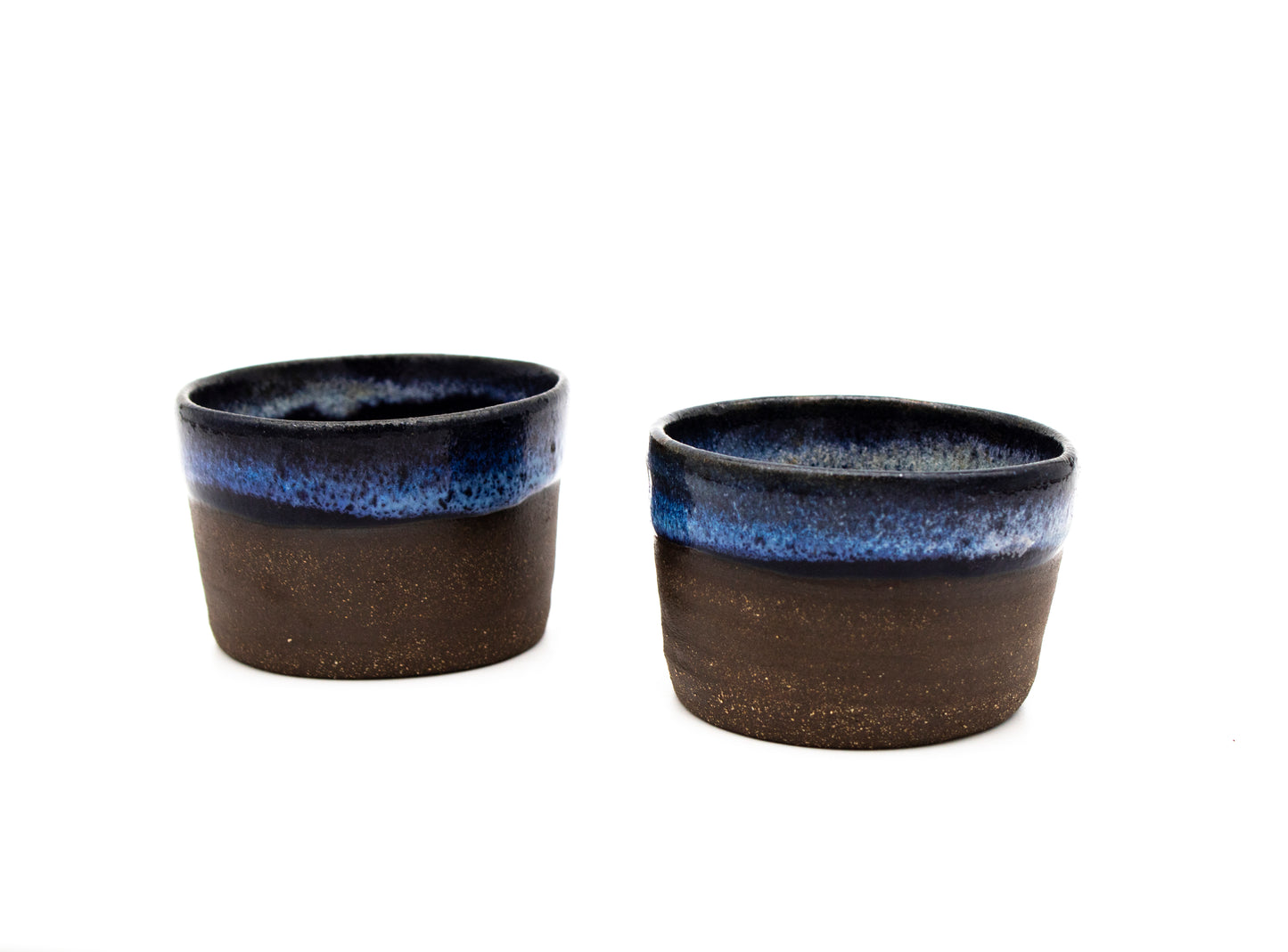 Handled Pitcher with Shades of Blue on Dark Brown Bared Clay