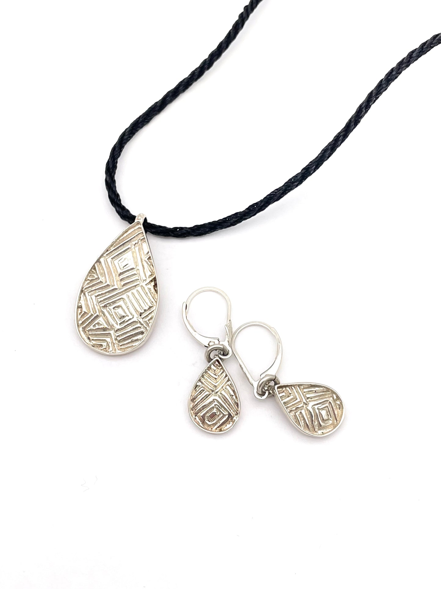 Matching Geometric-Patterned Earrings and Oval Pendant